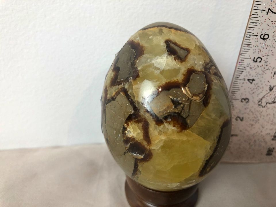 Serpentine carved egg 215g with wood stand